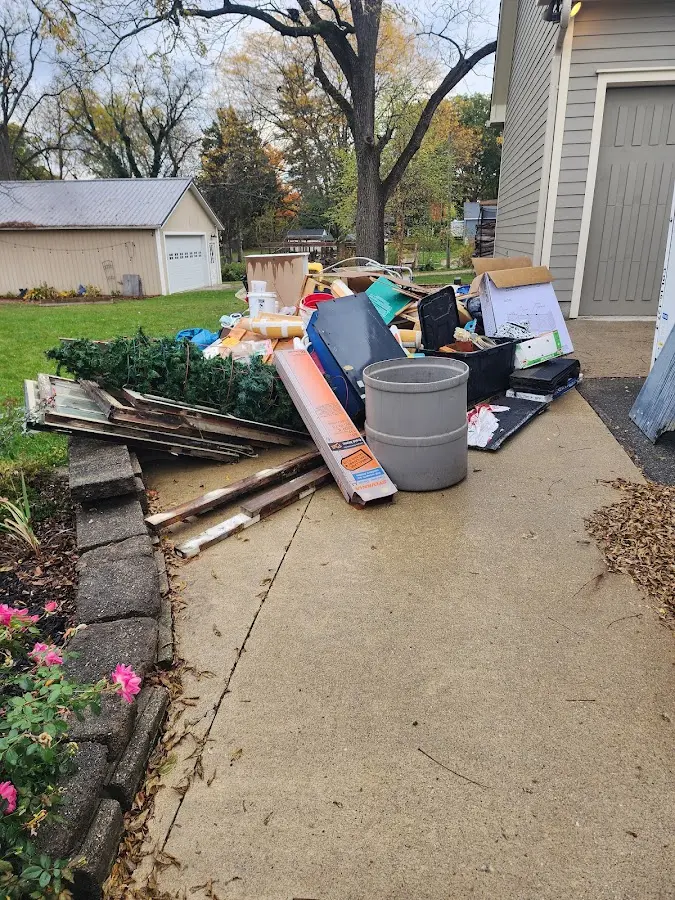 Dumpster being loaded with debris for 10 Yard Dumpster Rental in Bradley